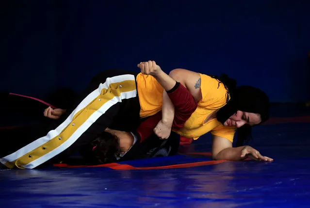 Iraqi women practice at the sports club in Diwaniya, Iraq on November 10, 2018. In September, Alia Hussein won a silver medal in the 75 kg (165 lb) freestyle category at a regional event in Lebanon and gold at a local tournament in Baghdad. “I faced opposition from my family at the beginning, but after my participation in Baghdad and Beirut tournaments they started to encourage me, thanks God”, Hussein said. (Photo by Alaa Al-Marjani/Reuters)