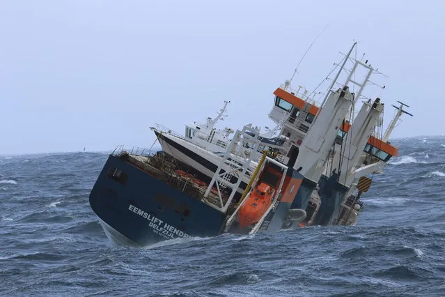 The unmanned Dutch cargo ship Eemslift Hendrika rolls in heavy seas, carrying heavy oil and diesel on board in the Norwegian Sea about 130 kilometers (80 miles) off the coast of Alesund on April 6, 2021. The crew was evacuated following a distress call from the vessel, and the Norwegian Coastal Administration said Tuesday they have dispatched a coast guard ship to inspect the situation. (Photo by Coast Guard Ship Sortland/NTB via AP Photo)