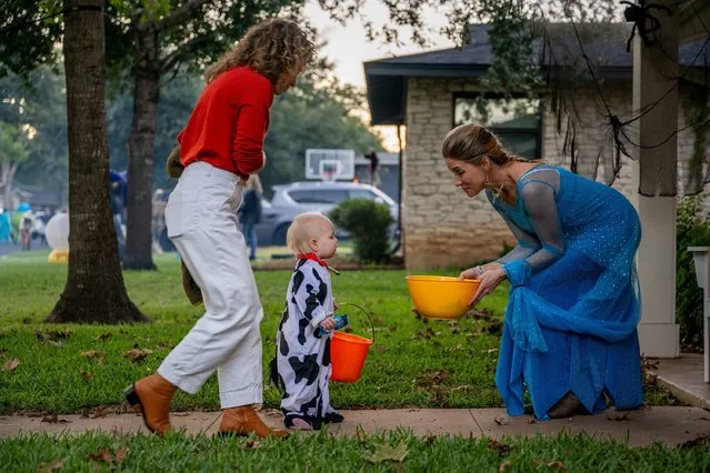 The Jarrard family Trick-or-Treat together in the Allandale neighborhood on October 31, 2023 in Austin, Texas. Community members and families came out to celebrate Halloween together. (Photo by Brandon Bell/Getty Images/AFP Photo)
