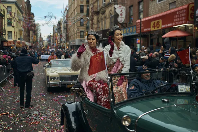 Beauty queens salute the crowd as they travel in a car during the Chinese Lunar New Year parade in Chinatown in New York, Sunday, February 17, 2019. (Photo by Andres Kudacki/AP Photo)