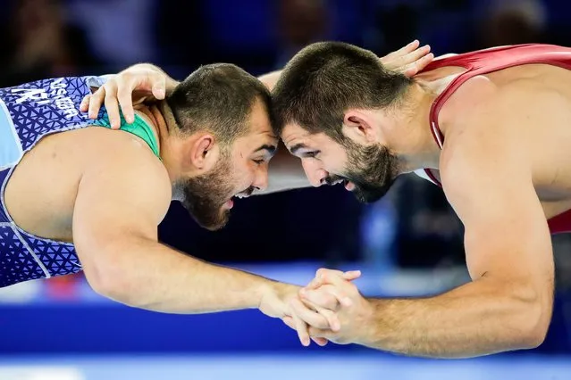 Geno Petriashvili (red) of Georgia in action against Amir Hossein Zare (blue) of Iran in their men's 125kg category gold medal bout during the Wrestling World Championships 2021 in Oslo, Norway, 03 October 2021. (Photo by Javad Parsa/EPA/EFE)