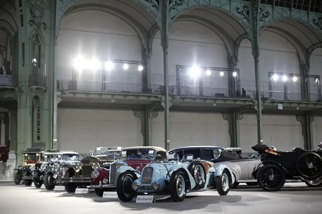 Vintage and classic cars are displayed by Bonhams auction house, during an exhibition, at the Grand Palais in Paris, Wednesday, February 5, 2014. (Photo by Thibault Camus/AP Photo)