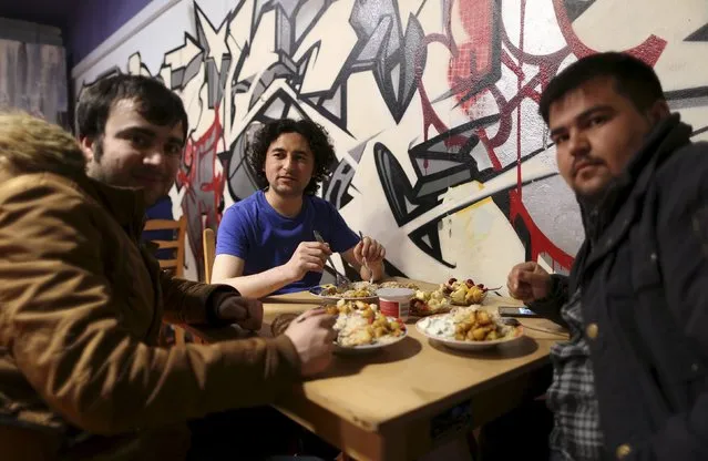 Migrants from Afghanistan and Syria eat at the community centre “SPIKE Dresden” in Dresden, Germany, March 22, 2016. (Photo by Ina Fassbender/Reuters)