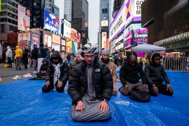 Members of the Muslim community gather at Times Square for the first Tarawih prayer of Ramadan on March 10, 2024 in New York City. Ramadan is observed by Muslims worldwide and is regarded as a commemoration of Muhammad's first revelation. The annual observance of Ramadan is celebrated by fasting until sunset each day (sawm), and prayer (salah). (Photo by David Dee Delgado/Getty Images)