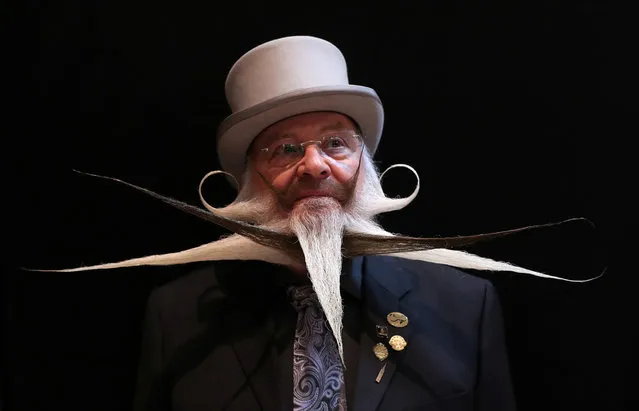 A participant of the international World Beard and Moustache Championships poses before taking part in one of the 17 categories of beard and moustache styles competing in Antwerp, Belgium May 18, 2019. (Photo by Yves Herman/Reuters)