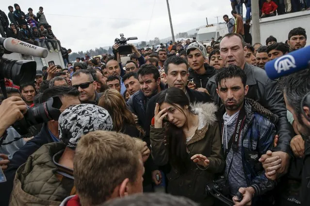 Nadia Murad Basee Taha (C), an Iraqi woman of the Yazidi faith who was abducted and held by the Islamic State for three months, walks through a makeshift camp for migrants and refugees at the Greek-Macedonian border near the village of Idomeni, Greece, April 3, 2016. (Photo by Marko Djurica/Reuters)