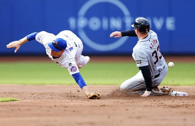 Detroit Tigers Colt Keith (33) steals second base as New York Mets shortstop Joey Wendle, left, is unable to handle the throw during the second inning in the second baseball game of a doubleheader, Thursday, April 4, 2024, in New York. (Photo by Noah K. Murray/AP Photo)
