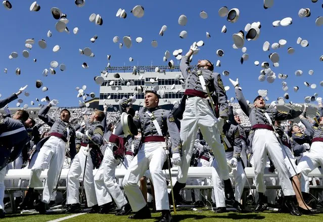 Graduates from the U.S. Military Academy toss their hats into the air after a graduation and commissioning ceremony on Saturday, May 23, 2015, in West Point, N.Y. (Photo by Mike Groll/AP Photo)