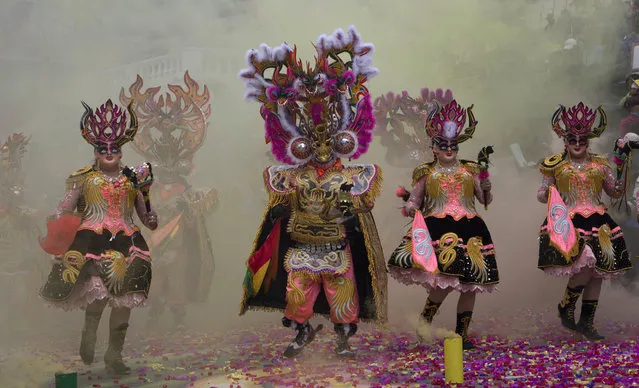 Dancers perform the traditional “Diablada” or Dance of the Devils, during the Carnival of Oruro, in Oruro, Bolivia, Saturday, February 25, 2017. The carnival is a religious festival dating back more than 200 years in an ongoing pagan-Catholic blend of religious practice in the region, and is one of UNESCO's Masterpieces of the Oral and Intangible Heritage of Humanity. (Photo by Juan Karita/AP Photo)