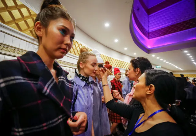 Models get ready backstage during Kazakhstan Fashion Week in Almaty, Kazakhstan, April 19, 2016. (Photo by Shamil Zhumatov/Reuters)