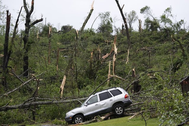A storm damaged car is seen along Blackburn Road, Thursday, May 9, 2024, in Columbia, Tenn. Severe storms tore through the central and southeast U.S., Wednesday, spawning damaging tornadoes, producing massive hail, and killing two people in Tennessee. (Photo by George Walker IV/AP Photo)