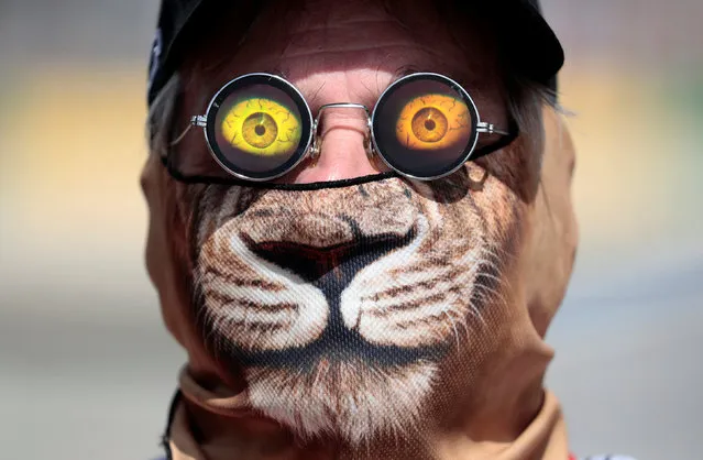 Formula One, Australian Grand Prix in Melbourne, Australia on March 24, 2017. Race official Graham Warren wears a cat mask and 3D sunglasses trackside during the first Formula One practice session. (Photo by Jason Reed/Reuters)