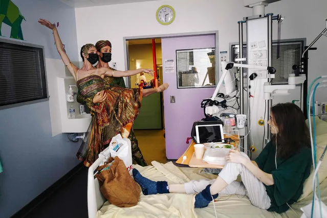 French Etoile (star dancer) of the Paris' Ballet of the Opera Hugo Marchand and French ballet dancer of the Paris Opera Ballet Dorothee Gilbert dance for Maely at the intensive care child unit of the Hopital Necker-Enfants Malades AP-HP in Paris, on June 11, 2021. (Photo by Lucas Barioulet/AFP Photo)