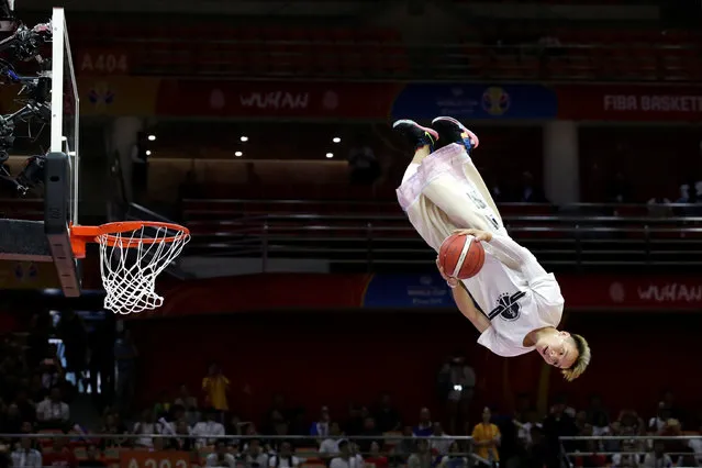 A dunk artist performs during halftime at the FIBA World Cup basketball match between South Korea and Nigeria in Wuhan, China on September 4, 2019. (Photo by Jason Lee/Reuters)