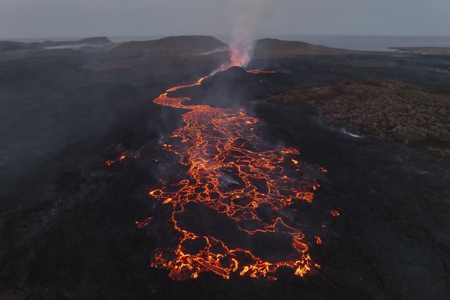 An overall view of the eruption site of the volcano near Grindavik, Iceland, Monday, June 10, 2024. A volcano in southwestern Iceland has been erupting spewing red lava close to the coastal town of Grindavik. (Photo by Marco di Marco/AP Photo)