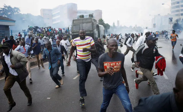 Protesters run away from the police during clashes in Nairobi, Kenya May 16, 2016. (Photo by Goran Tomasevic/Reuters)