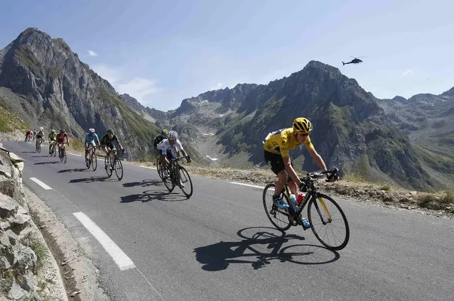 Team Sky rider Chris Froome of Britain (R), race leader's yellow jersey, cycles along the Tourmalet pass during the 188-km (116.8 miles) 11th stage of the 102nd Tour de France cycling race from Pau to Cauterets in the French Pyrenees mountains, France, July 15, 2015. (Photo by Eric Gaillard/Reuters)