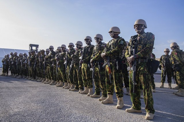 Kenyan police stand at their base during a visit by Haitian Prime Minister Garry Conille in Port-au-Prince, Haiti, Wednesday, June 26, 2024. The first contingent of U.N.-backed foreign police arrived the previous day, nearly two years after the Caribbean country requested help to quell gang violence. (Photo by Marckinson Pierre/AP Photo)