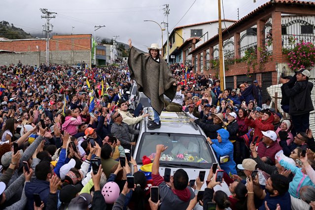 Venezuelan opposition leader Maria Corina Machado wears a traditional garment gifted by her followers as she tours the country despite not being able to run in the upcoming presidential elections, in Merida state, Venezuela on June 25, 2024. (Photo by Gaby Oraa/Reuters)