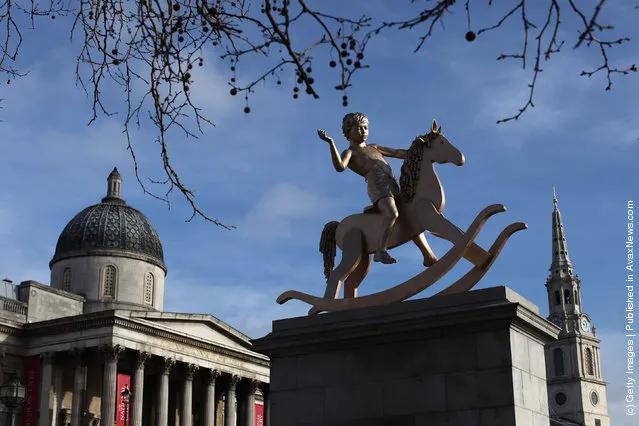 A sculpture entitled 'Powerless Structures, Fig.101' designed by Danish artist Michael Elmgreen and Norwegian artist Ingar Dragset is unveiled on the Fourth Plinth in Trafalgar Square