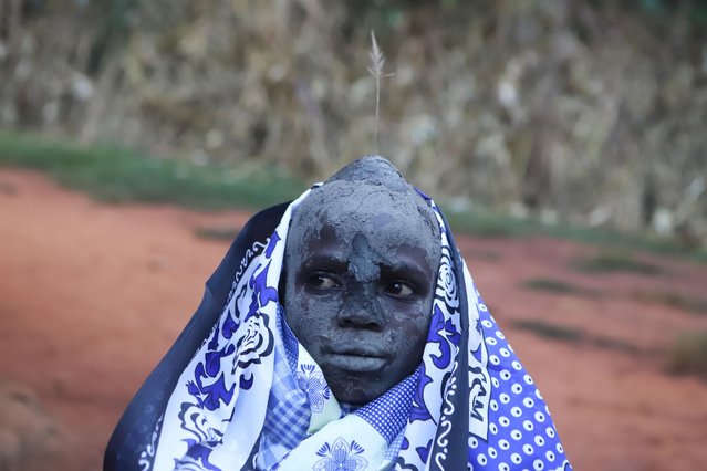 A Bukusu boy rests after undergoing public circumcision rituals among the Bukusu community in Narondo village, Bungoma County, Western Kenya, 01 August 2024. Circumcision is a rite of passage, in public, for the Bukusu teenagers, marking the transition from boyhood to manhood, hence proving their courage to the community. The ceremony is conducted biennially during even years, typically in August, with the community gathering to witness and support the initiates. (Photo by EPA/EFE/Stringer)