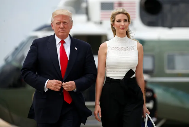 US President Donald Trump waves as he walks with his daughter Ivanka to board Air Force one at Andrews Air Force Base in Maryland on June 13, 2017 en route to Milwaukee, Wisconsin. (Photo by Kevin Lamarque/Reuters)
