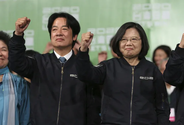 Taiwan's 2020 presidential election candidate, Taiwanese President Tsai Ing-wen, right, and her running mate William Lai celebrate their victory with supporters in Taipei, Taiwan, Saturday, January 11, 2020. Taiwan's independence-leaning President Tsai Ing-wen won a second term in a landslide election victory Saturday, signaling strong support for her tough stance against China. (Photo by Chiang Ying-ying/AP Photo)