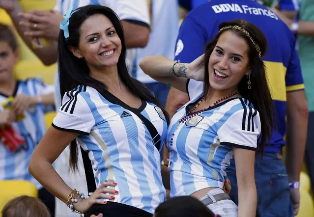 Fans of Argentina pose as they wait for the start of their 2014 World Cup final against Germany at the Maracana stadium in Rio de Janeiro July 13, 2014. (Photo by Darren Staples/Reuters)