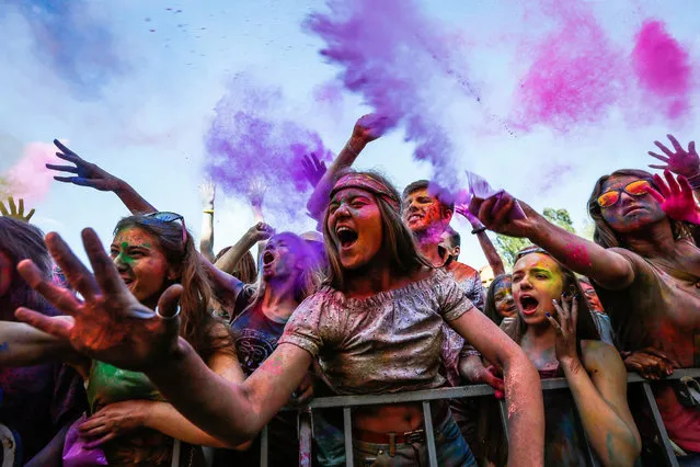 Participants enjoy the “Festival of Colors” in Kiev, Ukraine, 25 June 2016. The event is inspired by the traditional Hindu Holi spring festival of colors in India. (Photo by Roman PilipeyEPA)