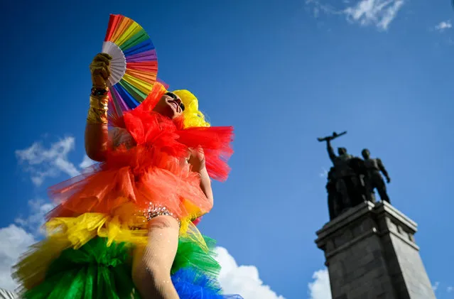 People take part in the annual Gay Pride Parade in downtown Sofia, on June 18, 2022. (Photo by Nikolay Doychinov/AFP Photo)