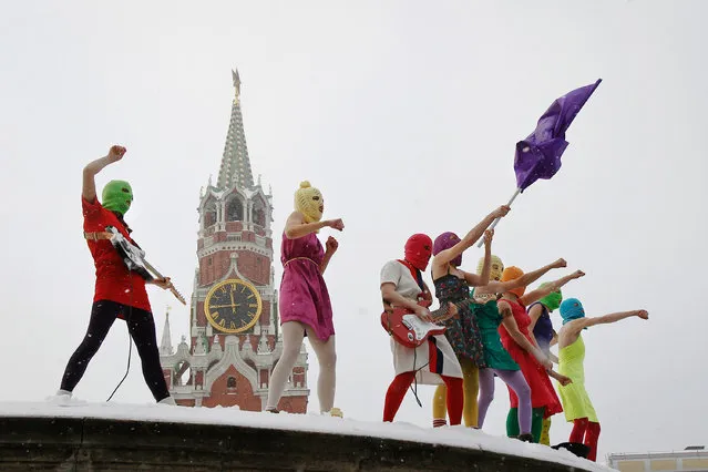 Members of the radical feminist punk group “p*ssy Riot” stage a protest against Vladimir Putin’s policies at the so-called Lobnoye Mesto (Forehead Place), long before used for announcing Russian tsars’ decrees and occasionally for carrying out public executions, in Red Square in Moscow. (Photo by Denis Sinyakov/UNC Asheville)