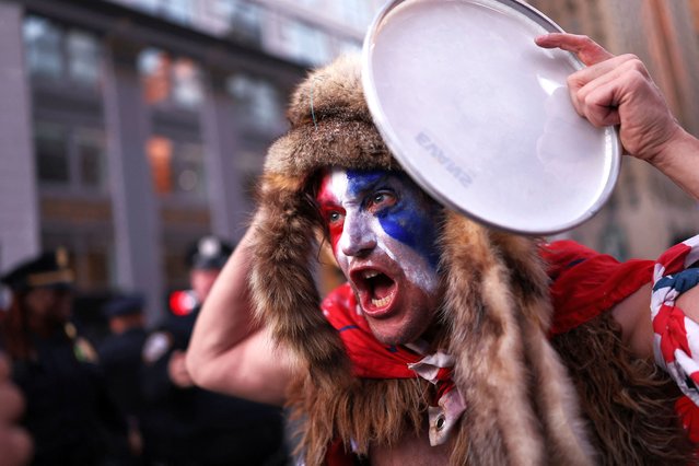 A supporter of Donald Trump shouts outside Madison Square Garden on the day of Trump's rally on October 27, 2024. (Photo by Hannah McKay/Reuters)