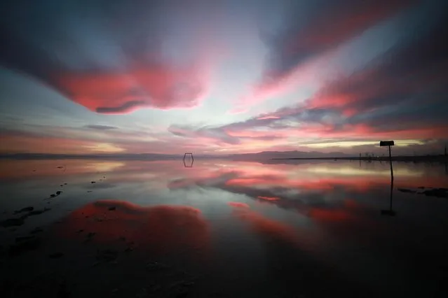 Sunset is reflected in the Salton Sea as seen from Bombay Beach, California, U.S., March 15, 2022. (Photo by David Swanson/Reuters)
