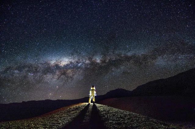 “People and Space”. Highly commended: Interstellar Travel by Fu Dingyan (China) In an attempt to recreate feeling of travelling in space, the photographer escaped the lights of the city and ventured to Réunion Island, located off the coast of Madagascar. Dressed in a spacesuit, standing under the southern Milky Way and the Large and Small Magellanic Clouds, the photographer resembles an interstellar traveller Réunion Island, France, 3 September 2016 Nikon D4S camera, 14-24 mm lens at 14 mm f/2.8, ISO 500, 30-second exposure. (Photo by Fu Dingyan/Insight Astronomy Photographer of the Year 2017)