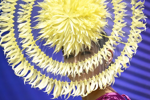 A woman competes in the “Fashions in the Field” event before the start of the Melbourne Cup horse race at the Flemington Racecourse in Melbourne on November 7, 2023. Held on the first Tuesday of November since 1876, the punishing 3,200 metre (two-mile) handicap at Flemington is regarded as the ultimate test of stamina and staying power. With Aus$8 million (US$6 million) at stake, the winner of the 24-strong field will bank Aus$4.4 million and instantly become a household name in Australia where the race is a cultural institution. (Photo by William West/AFP Photo)
