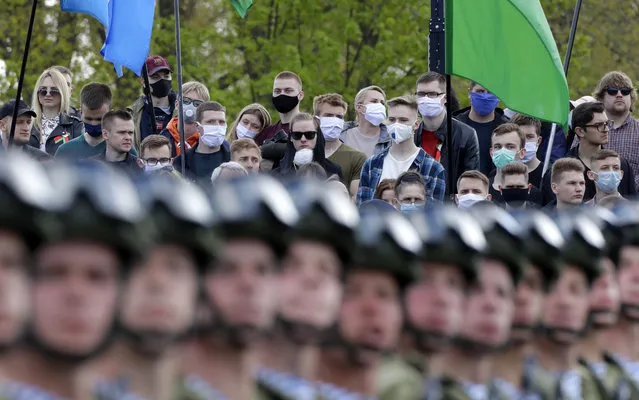 People attend the Victory Day military parade that marked the 75th anniversary of the allied victory over Nazi Germany, in Minsk, Belarus, Saturday, May 9, 2020. Belarus remains one of the few countries that hadn't imposed a lockdown or restricted public events despite recommendations of the World Health Organization. (Photo by Sergei Grits/AP Photo)