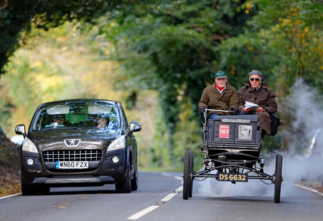Participants seen driving a steam powered 1901 Locomobile during the annual London to Brighton Veteran Car Run on November 5, 2023 in Staplefield, West Sussex, England. The event marks the anniversary of the Emancipation Run when, on 14 November 1896, a group of enthusiastic motorists set off from London to Brighton to celebrate the passing of the 'Locomotives on Highway Act' which increased the speed limit from 4mph to 14mph. (Photo by Max Mumby/Indigo/Getty Images)