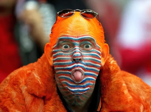 A Netherlands fan with his face painted is seen in the stand before the match against Poland during UEFA Nations League action at PGE Narodowy in Warsaw, Poland on September 22, 2022. (Photo by Kacper Pempel/Reuters)