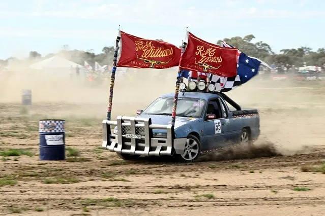Utes compete in the circle work competion on day one of the annual Deniliquin Ute Muster, in Deniliquin, New South Wales, Australia, 30 September 2022. The muster celebrates all things Australian and the icon of the Ute (a pickup vehicle), and runs on 30 September and 01 October 2022. (Photo by Joel Carrett/EPA/EFE)