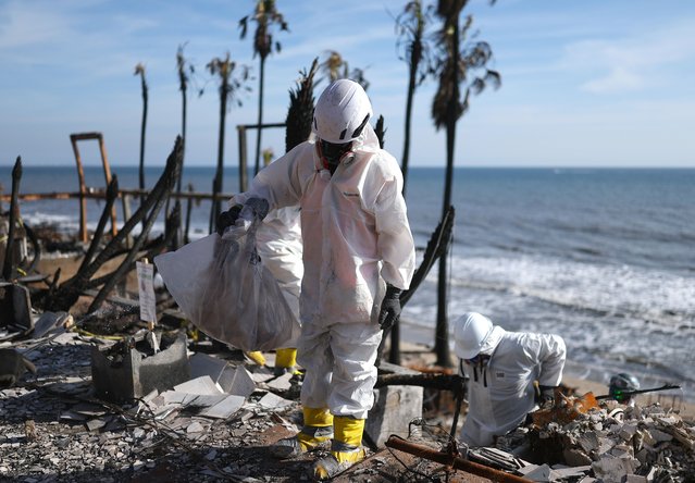 Environmental Protection Agency (EPA) contractors work to remove hazardous waste from beachfront properties destroyed in the Palisades Fire along the Pacific Ocean on February 18, 2025 in Malibu, California. The Federal Emergency Management Agency (FEMA) and the Army Corps of Engineers have begun private property debris removal from the Eaton and Palisades fires while the EPA announced yesterday it has cleared or deferred 75 percent of properties affected by the fires. (Photo by Mario Tama/Getty Images)