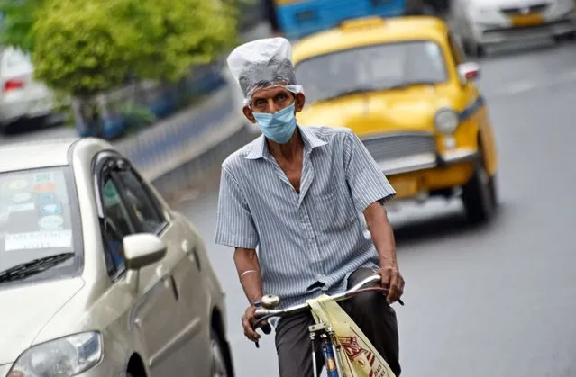 A man wears a face mask as a preventive measure against Coronavirus in Kolkata, 12 June, 2020. Record rise in Novel coronavirus as India became the world's fourth worst hit country raising the prospect of the return of a lockdown just days after it was lifted according to an Indian media report. (Photo by Indranil Aditya/NurPhoto via Getty Images)