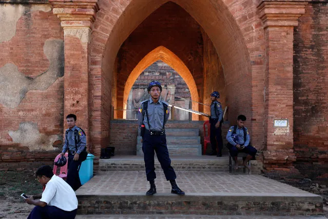 Myanmar policemen stand outside a collapsed pagoda after an earthquake in Bagan, Myanmar August 25, 2016. (Photo by Soe Zeya Tun/Reuters)