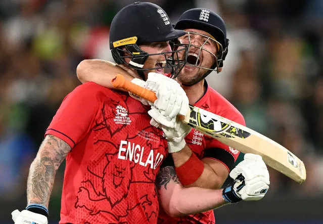 England's Ben Stokes (L) and teammate Liam Livingstone celebrate after victory in the ICC men's Twenty20 World Cup 2022 final cricket match England and Pakistan at The Melbourne Cricket Ground (MCG) in Melbourne on November 13, 2022. (Photo by William West/AFP Photo)