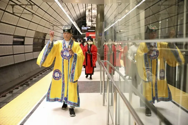 The Rev Norman Fong from the Lotus Taoist Institute and Presbyterian church in Chinatown leads a blessing ceremony for the new subway line and station in San Francisco, US on November 18, 2022. (Photo by Yalonda M. James/AP Photo)
