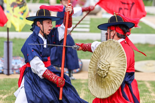People clad in traditional Korean military attire demonstrate martial arts from the 1392–1910 Joseon Dynasty at a plaza in Seoul, South Korea, 06 May 2025. The performance, organized by the Seoul metropolitan government, began the same day and will run for 1 hour and 10 minutes from 3:20 p.m. every Friday, Saturday, and Sunday. (Photo by Yonhap/EPA/EFE)