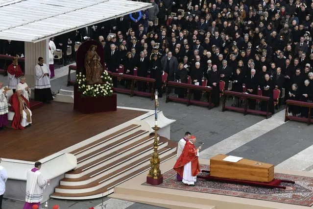 Pope Francis, seated left, presides over the funeral of Pope Benedict XVI at the Vatican on Thursday, January 5, 2023. (Photo by James Hill/The New York Times)