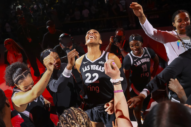 Las Vegas Aces center A'ja Wilson (22) celebrates with teammates after defeating the Connecticut Sun in a WNBA basketball game on Wednesday, June 25, 2025, in Las Vegas. Wilson reached 5,000 career points in the game. (Photo by Chase Stevens/Las Vegas Review-Journal via AP Photo)