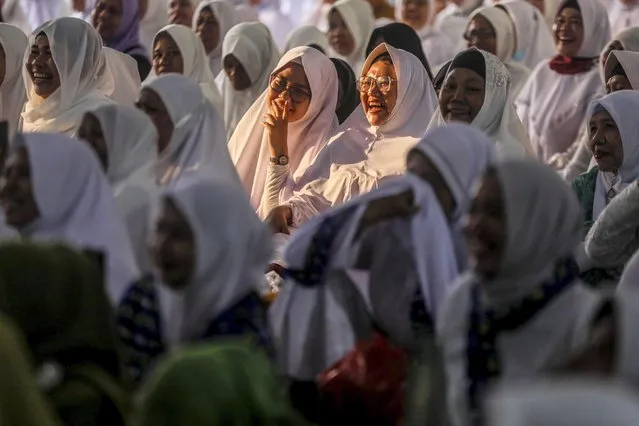 Muslim women pray during a mass prayer ahead of New Year Eve in Medan, North Sumatra, Indonesia, 31 December 2022. (Photo by Dedi Sinuhaji/EPA/EFE/Rex Features/Shutterstock)