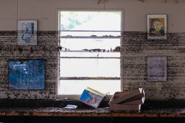 Frames hang from a wall with flood marks at Camp Mystic, on July 7, 2025. (Photo by Marco Bello/Reuters)