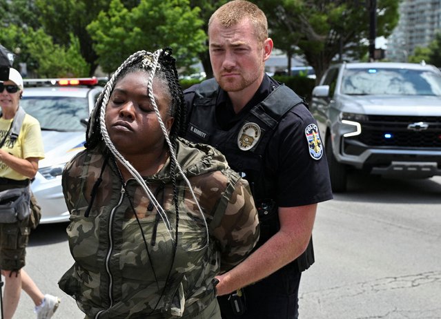 Bianca Austin, Breonna Taylor's aunt, is detained outside of the Gene Snyder Federal Building after leading protesters to block the roadway on the day of the sentencing of former Louisville police officer Brett Hankison for violating the rights of Breonna Taylor, who was shot and killed by police officers in March 2020 after they used a no-knock warrant at her home, in Louisville, Kentucky, U.S. July 21, 2025. (Photo by Jon Cherry/Reuters)